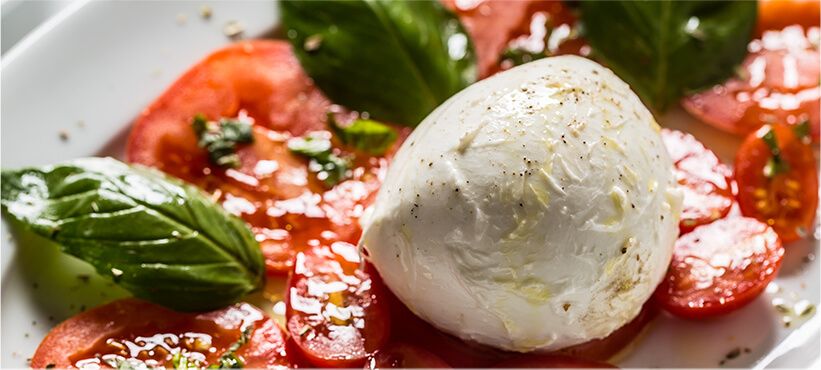 Italian burrata with tomatoes and basil.